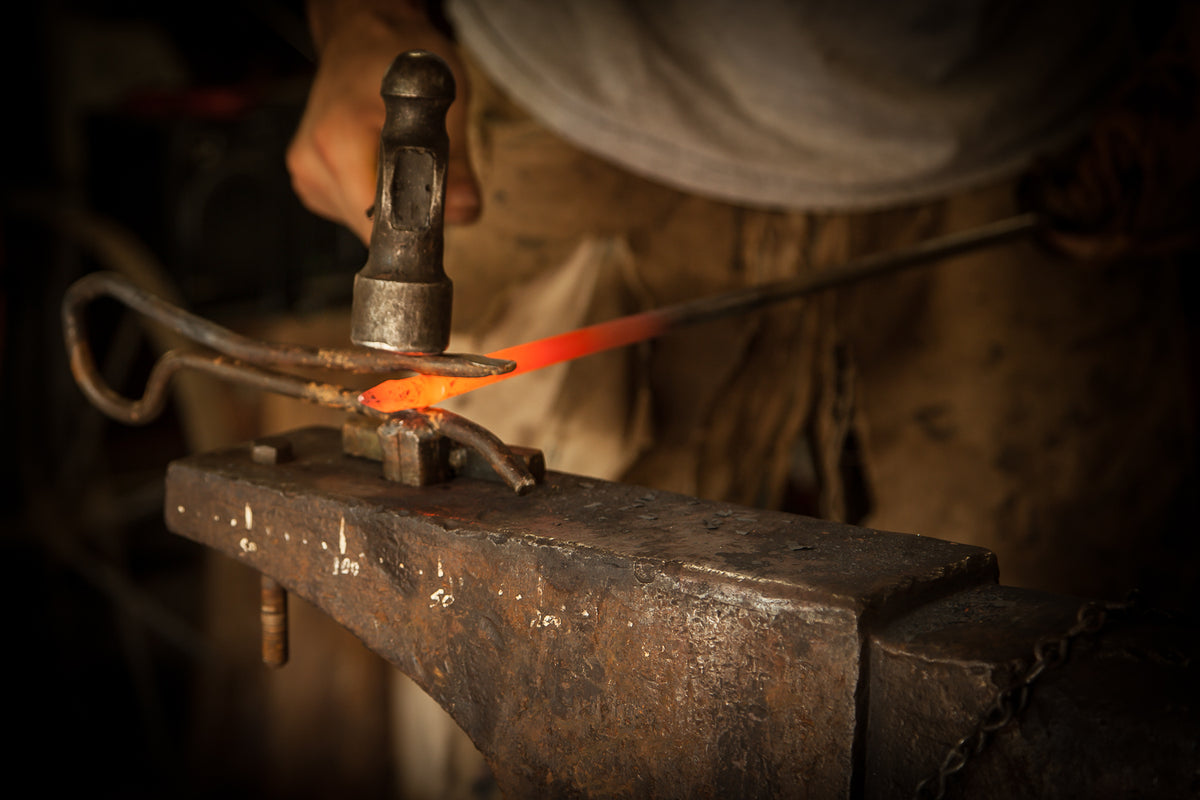 The blacksmith. Craftsmanship forging techniques in the forge and iron work